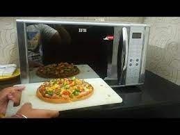 So the air around the pizza (which is cooled by it) flows in convection currents, and interracts with hotter air. How To Make Pizza In Ifb Microwave With Convection Mode Youtube