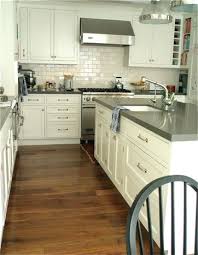 Colorful paintings on the gray walls create a warmer environment. Ooooooo Yum Kitchen Remodel Countertops Kitchen Design Kitchen Remodel
