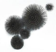 The entirety of the décor is done in tones of gray and white. Dark Gray Sea Urchins Wall Art