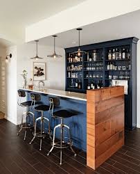 A bar with a few funky bar stools and a plethora of different spirits sourced from different parts of the world! Modern Home Bar Decor Ideas Novocom Top