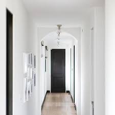 These products are designed to make your faded black trim look like a new one. White Hallway Walls With Black Trim Design Ideas