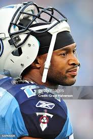 Malcolm Sheppard of the Tennessee Titans sacks quarteback Caleb Hanie...  News Photo