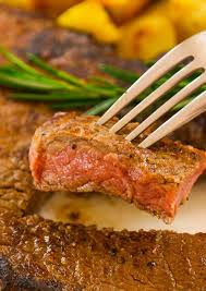 A Piece Of Sirloin Steak On A Fork After Being Perfectly Cooked To Medium Rare Doneness With A Pale Pink Col Sirloin Steak Recipes Sirloin Steaks Steak Recipes