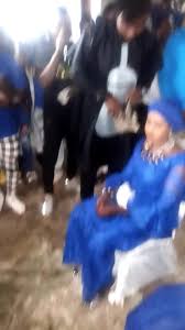 Ceremonial Celebration with Intricate Blue Garment