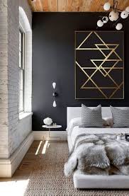 A minimalist masculine living room with graphite grey walls, an emerald velvet sofa and a sleek grey table. Wall Art Mens Bedroom Wall Decor Trendecors