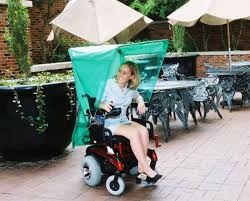 an automatic umbrella or rain cover that attaches to a powered wheelchair and operates w wheelchair accessories powered wheelchair power wheelchair accessories