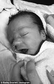 NZ bikini model Bailey Scarlett, 20, welcomes her baby son Riley Arlo