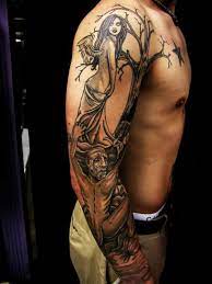 Brilliant grey ink evil tattoo on left full sleeve. Good And Evil Sleeve Tattoo Designs