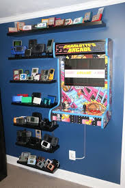 Retro Gaming Wall Handheld Collection Shelves And Wall Mounted Arcade Cabinet Via Reddit User Joeyblaz Video Game Rooms Retro Games Room Game Room Furniture