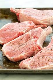 Baked thin pork chops make this sheet pan dinner quick and tasty! Pan Fried Pork Chops With Garlic Butter Jessica Gavin