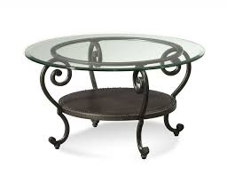 For those who want a glass coffee table that doesn't just blend into the background, this pick from world market is sure to garner compliments from all of. Glass Topped Coffee Tables Wrought Iron Iron Coffee Table Round Glass Coffee Table Round Metal Coffee Table