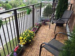 Turn A Boring Concrete Apartment Balcony Into Your Own Garden Oasis We Bought Wood Tiles That Snap Together And Sit Apartment Balconies Backyard Balcony Decor