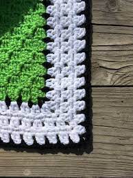 This Black And White Block Stitch Border Really Makes The Three Toed Sloth Stand Out C2c Crochet Blanket Crochet Blanket Border Sloth Blanket