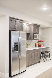 Basement Kitchenette Dark Cabinets With White Washed Brick Backsplash Small Basement Kitchen Small Kitchen Bar Kitchen Bar Design