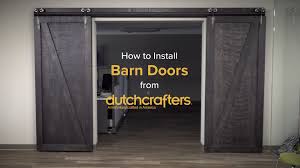 Sliding door of barn in morning sunlight. How To Install Interior Sliding Barn Doors Dutchcrafters Videos