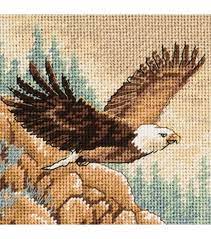 It is a black and white symbol pattern. Cross Stitch Eagle Cross Stitch Bird Cross Stitch Cross Stitch Patterns
