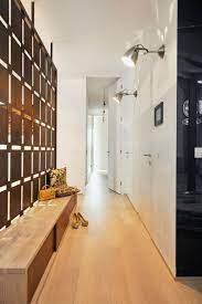 Shoe Closet Made Of Wood Inside A Narrow Hallway With Pale Laminate Floor Small Hallway Ideas Whi Small Closet Door Ideas Small Hallways Hallway Decorating