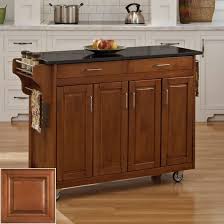 This utility cabinet features a slab door in a durable dark walnut finish that is easy to clean. Best Oak Cabinets Painted Blue Oakkitchencabinets Kitchencabinets Kitchen Island With Granite Top Portable Kitchen Island Kitchen Tops Granite