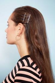 Swap out your traditional hair tie and lock in your look by using bobby pins to create a triangle design. 12 Cool Bobby Pin Hairstyles To Add To Your Hair Routine