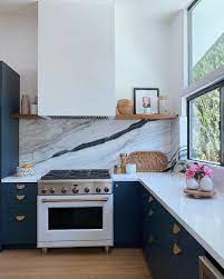 And the white countertops, sink, and trim help to give the room definition. Talk About A Statement Backsplash This Kitchen By Rebecca Raskind Is Just Gorgeous All Thanks To The Show St Kitchen Remodel Kitchen Renovation Kitchen Plans