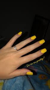 The nails are short and are painted in a bright neon yellow shade. Yellow Acrylic Nails Acrylicspringnails Acrylic Nails Yellow Yellow Nails Yellow Nails Design