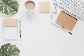 Stationery And Keyboard On White Table With Green Leaves And Coffee Cup White Table Coffee Cups Flower Background Wallpaper