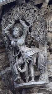 Tribhanga pose, literally meaning three parts break, consists of three bends in the body; Belur Chennakeshava Temple Tribhangi Yatrika