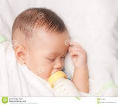 Baby Boy Holding Milk Bottle Stock Image Image Of Asia Sleep 15676911