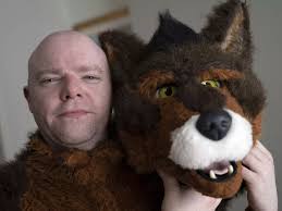 Behind the mask of the 'human pup' who eats from a dog bowl and greets pals  by barking