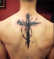In god we trust vengeance is mine sayeth the lord no fear the lettering of the middle two lines was in reverse so that it could be read in the mirror. Cross Tattoo Designs 10 Examples For You To Consider Eal Care