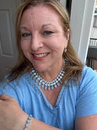 This is my beautiful Custom made Ukelele, made by my husband, Tony Sobczak.  It is Electric, with an internal tuner, preamp, and it folds up inside the  body for traveling. If the