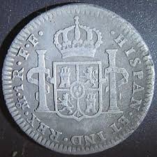 Depends on a lot of factors including soil type and how the coin is laying (flat or on edge). Favorite Finds International Garrett Metal Detectors