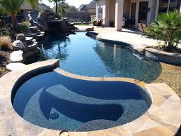 Glossy Black Pebbles Are Combined With Royal Blue Accent Stone And Ocean Shells Outdoor Pool Blue Accents Pool