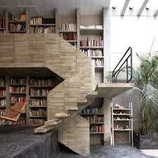 Under the staircase is a closet, which houses the cat pan and food bowl… hidden from guests and the curious dog. Bookshelf Staircases Dezeen
