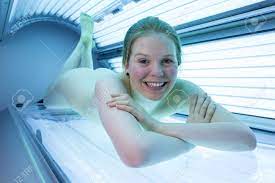 Naked Woman Relaxing On Tanning Bed In Solarium Stock Photo, Picture and  Royalty Free Image. Image 26239701.