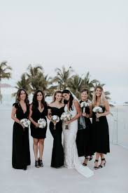 Stunning Bride And Her Bridesmaids Wearing All Black And Whites Beach Wedding At Paradisus Los C Beach Wedding White Beach Wedding Attire Beach Wedding Black