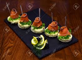 Easy easter finger food recipe to prepare appetizers with. Cold Appetizers Canape With Red Fish Wooden Background Canape Stock Photo Picture And Royalty Free Image Image 99961284