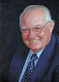 Display of colorful flowers in the square. John Dennis Fitzgerald Obituary Service Details