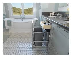 The midnight blue of the refinished tub ties the room together, adding a deeper value to the naturally lit space. Grey Bathroom Vanity Crystal Cabinets