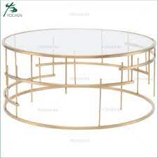 Heavy iron in antique gold finish with clear tempered glass. China Glass Top Gold Metal Round Coffee Center Table China Round Coffee Table