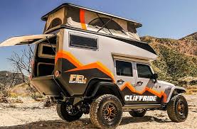 The concept jeep has a rooftop tent that can sleep four and features often found inside a typical camper, such as a refrigerator, stove, and table. Jeep Camper Becomes The Ultimate Rock Crawling Adventure Vehicle
