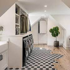 Huge custom designed and built laundry room that is about as perfect as it gets with sink, elevated appliances, plenty of cabinets, lots of floor space to organize clothing and so much. Mixed Laundry Room Floors Design Ideas