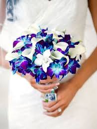 The handle is wrapped with a satin ribbon. 43 Best Blue Orchid Wedding Ideas Wedding Blue Orchid Wedding Orchid Wedding