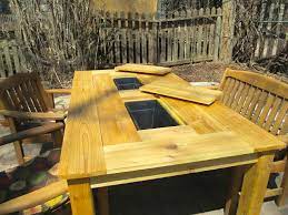 It Looks Like An Ordinary Picnic Table But It S Hiding A Built In Cooler Patio Party Table Wood Patio Table Bbq Table