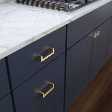 For a seamless look, opt for recessed cabinet pulls that blend in with your cabinetry. Brainerd Squared Modern 3 3 4 In Center To Center Brushed Brass Novelty Handle Cabinet Door Pull Lowes Com Navy Blue Kitchen Cabinets Gold Kitchen Hardware Kitchen Cabinet Handles
