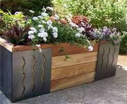 A raised garden bed—essentially a large planting box—is the ultimate problem solver: Inside Urban Green International M Brace Raised Bed Planter
