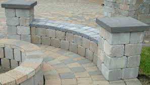The circular wall creates a sense of enclosure and privacy even though the wall is low. Curved Bench Western Interlock Curved Patio Brick Patios Patio Bench
