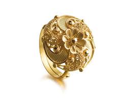 Would Love To Wear Tanishq S Motif Ring To My Wedding Gold Ring Designs Pure Gold Jewellery Tanishq Jewellery