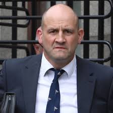 Vet who wore Donald mask at meat plant contests 'savage' removal from post 