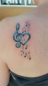 The music notes are the most prominent and most broadly dispersed of the music tattoo designs. In Memory Of My Gram Music Tattoos Music Tattoo Designs Shoulder Blade Tattoo